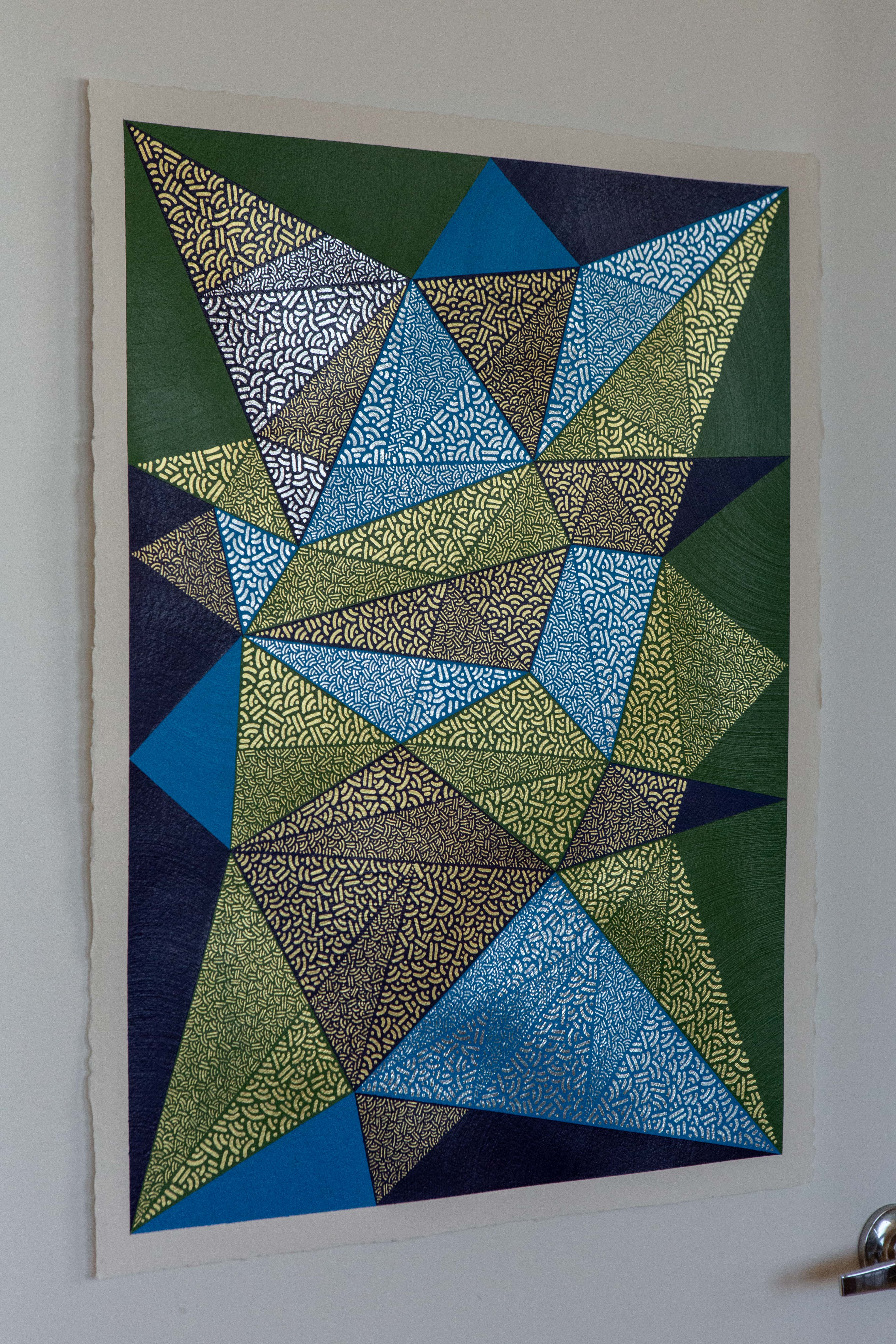 Paths: Blue and green triangular composition displayed vertically on a white wall.