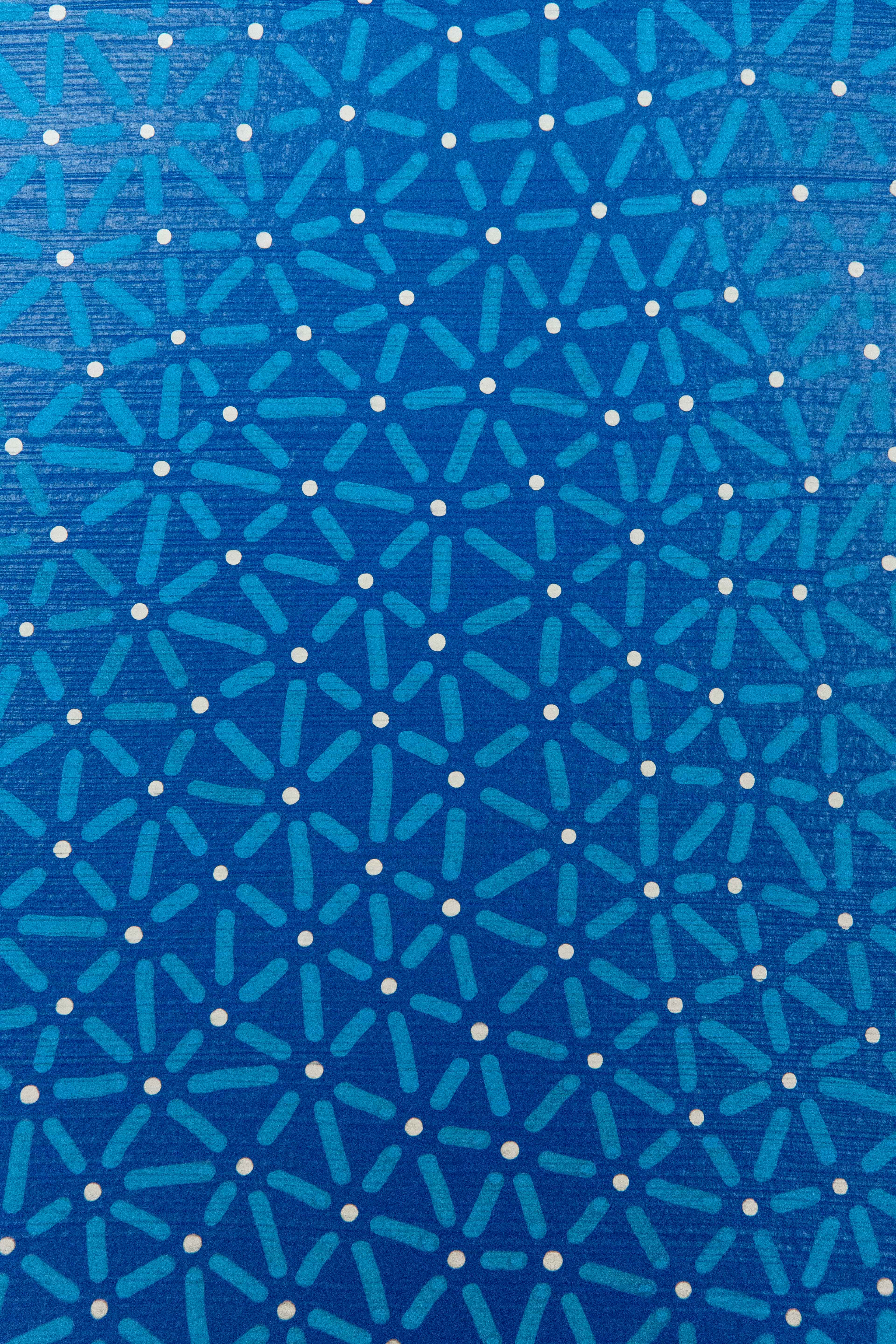 The Blue Nexus: Close-up of turquoise connecting lines and pale dots forming a dense circular pattern on blue.