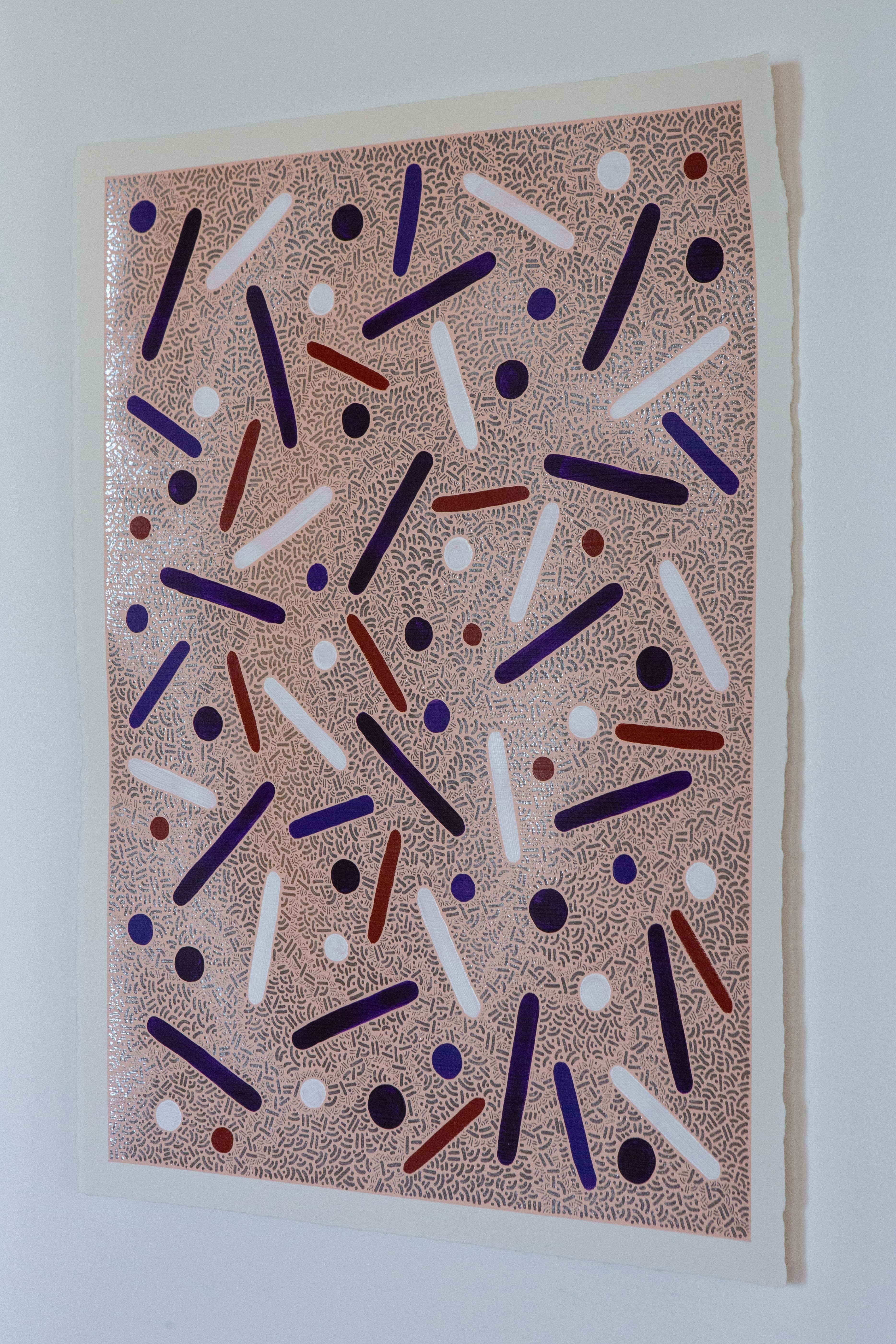 Side view of Desert Bloom by Pipe Yanguas mounted on white backing, with colored dots and lines over a finely worked silver background.